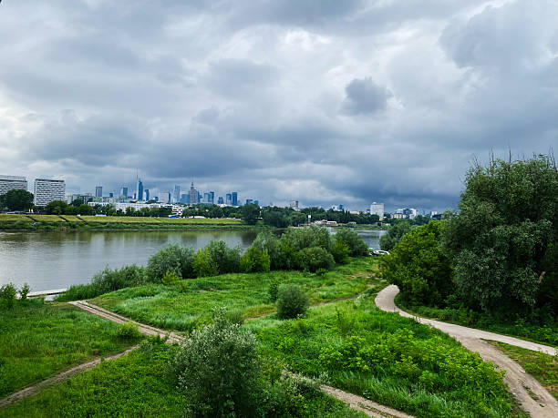 istock City skyline view with river and greenery under a cloudy sky. Warsaw, Poland. 2204407323