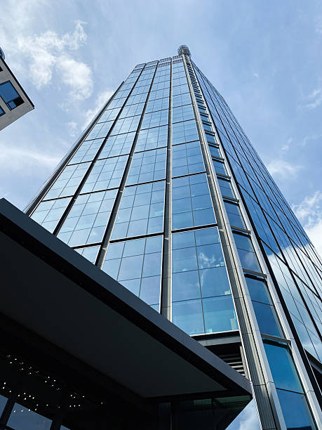 istock Modern skyscraper with glass facade under a bright blue sky in Warsaw. 2204407327