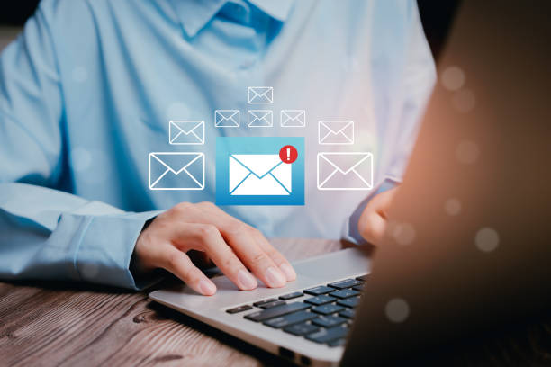 istock Person Typing on Laptop with Mail Notifications in a Bright, Modern Workspace Setting, Business concept 2204408610