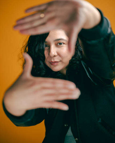 istock Studio Headshot - Pakistani Woman - Framing Face with Hands 2204409595