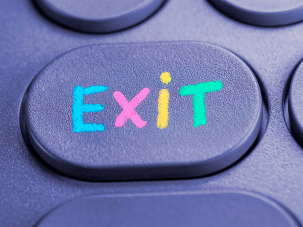 istock Close-up of the word EXIT on a computer keyboard key written with colored chalk 2204412131