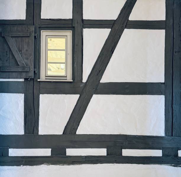 Half timbered house detail with small window