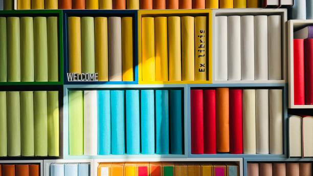 Library, colorful generic book spines in shelves, welcome sign