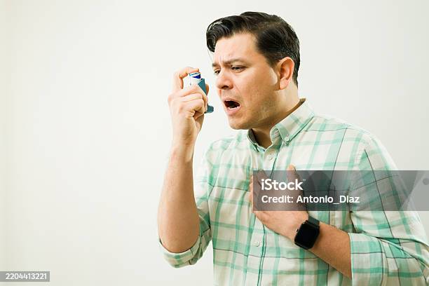 Chest Inhalor Man Using An Inhaler During An Asthma Attack Experiencing Breathing ...