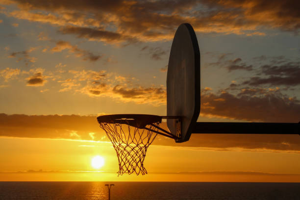 istock Basketball Hoop at Sunset 2204415577