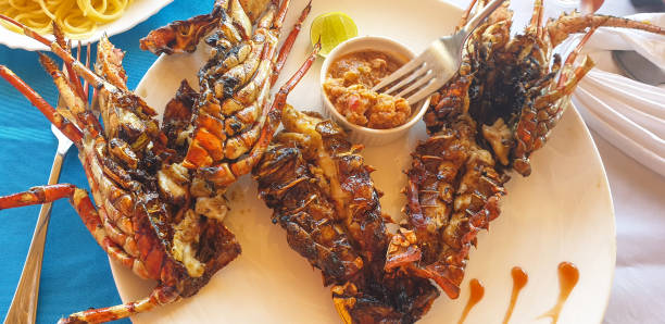 istock Red barbequed lobsters on plate 2204415724