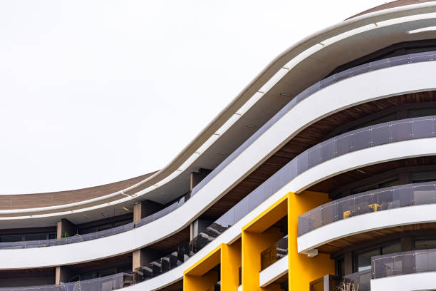 A close-up view of a contemporary housing dwelling with a sleek and modern Mediterranean facade in Antalya Turkey. The clean lines, elegant textures, and sophisticated design make this image ideal for promoting architecture studios, real estate agencies, construction companies, and design firms. Perfect for print media, posters, backgrounds, and branding materials.