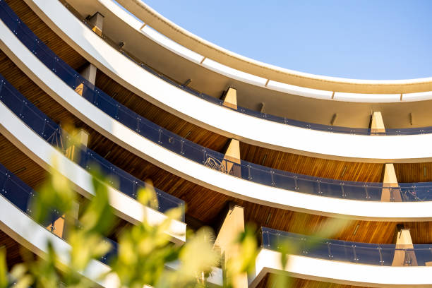 A close-up view of a contemporary housing dwelling with a sleek and modern Mediterranean facade in Antalya Turkey. The clean lines, elegant textures, and sophisticated design make this image ideal for promoting architecture studios, real estate agencies, construction companies, and design firms. Perfect for print media, posters, backgrounds, and branding materials.