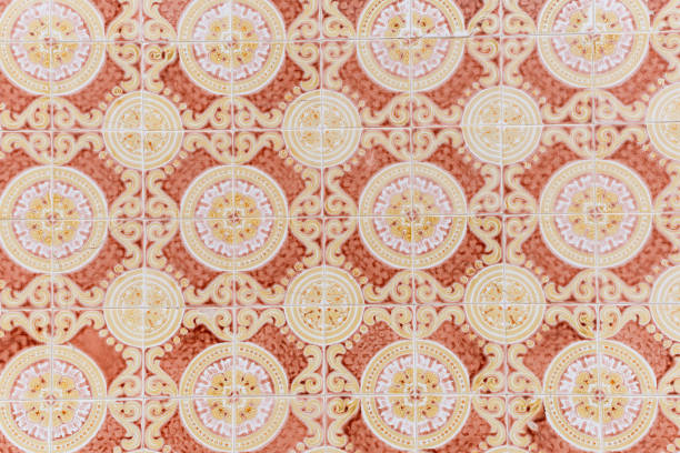 Vintage decorative tiles with elaborate circular and swirling patterns.