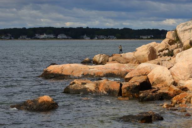 istock Fishing on Rocky Shores 2204421266