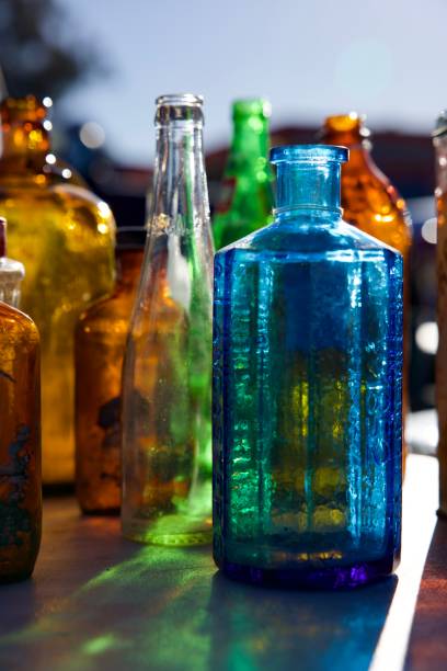 istock Backlit Vintage colored glass bottles 2204422961