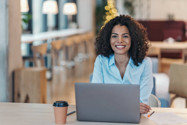 istock Cheerful black businesswoman in an open office space 2204423780