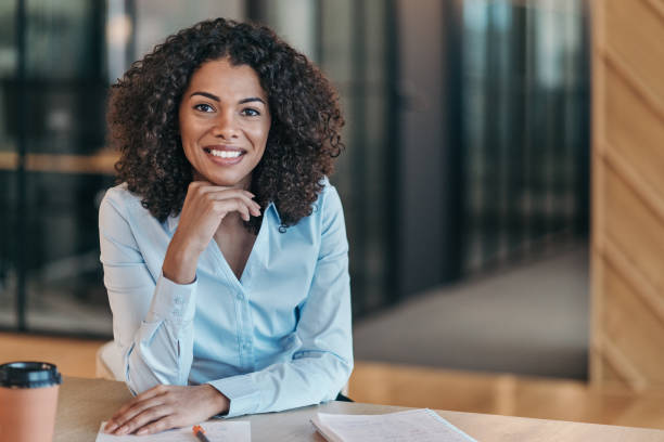 istock Young smiling businesswoman working in her office 2204423795