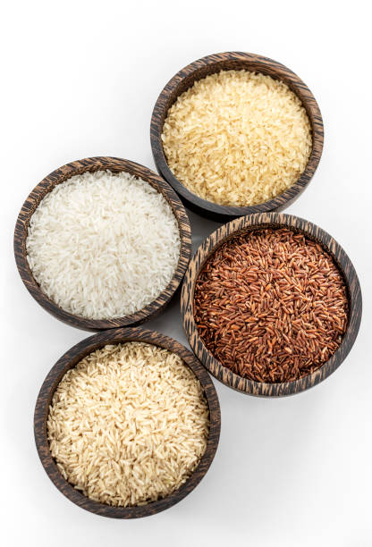 istock different kinds of asian rice grains in bowls on white background 2204426696