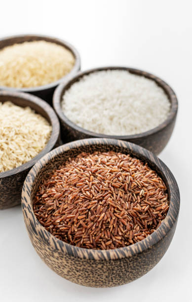 istock different kinds of asian rice grains in bowls on white background 2204426702
