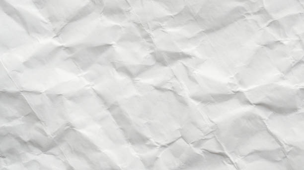 istock Abstract white crumpled and creased recycle paper texture background 2204435529