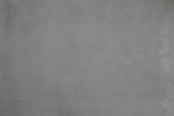 Gray paint on cement wall, textured concrete background, rough surface of abstract material.