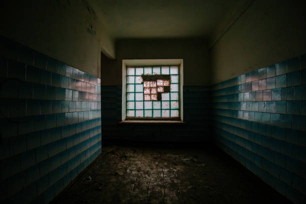 istock Corridor with block glass window in abandoned building 2204437406