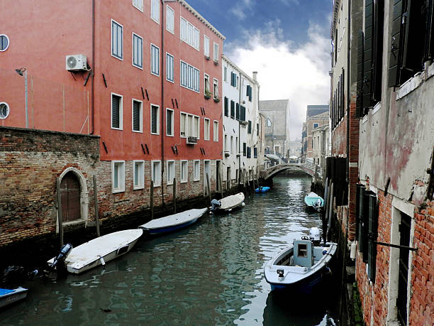 Canal and buildings with boats in front