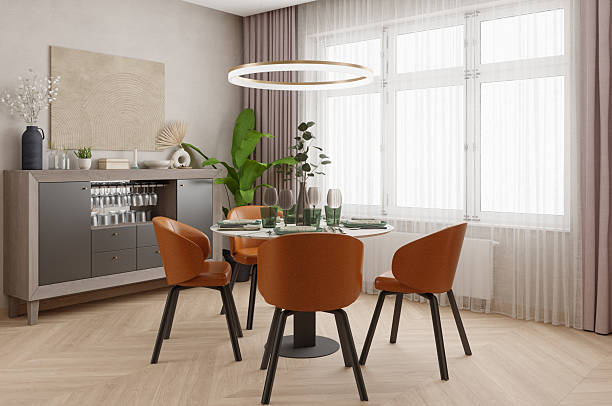 istock Modern dining area with orange chairs, green plants 2204448968