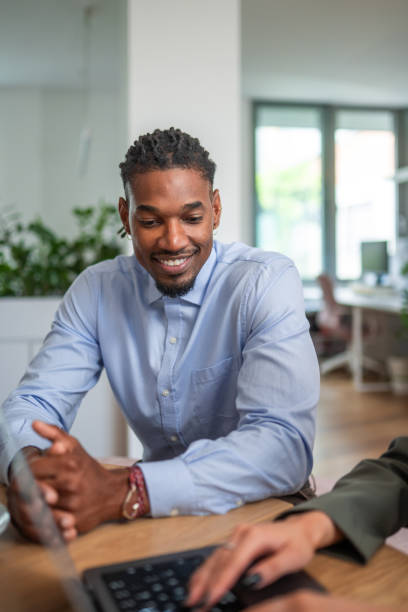 istock Professional Black Businessman Engaged in Meeting 2204449646