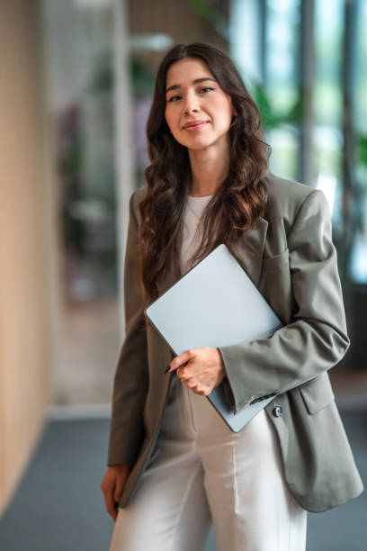 istock Confident Female Entrepreneur in Office With Laptop 2204449663