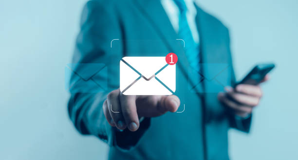 istock communication, digital marketing, businessman responding to floating digital interface showing new email notification symbol. 2204450661