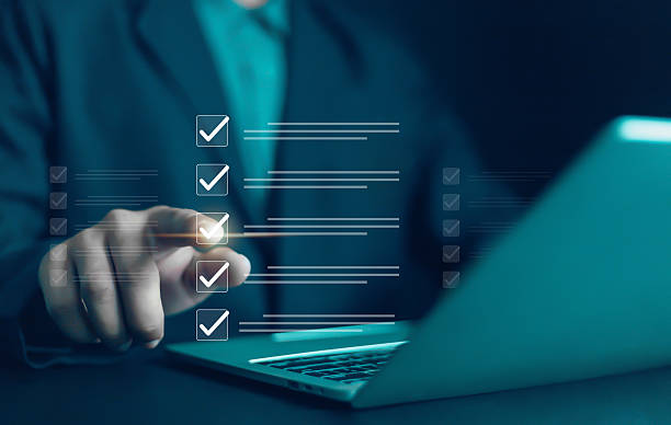 istock Business Performance Checklist Businessman Using Laptop Doing Online Checklist Survey On Computer Filling Out Digital Form Checklist Survey Doing Assessment Questionnaire Evaluation 2204450895