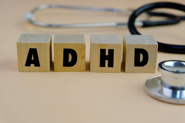 istock ADHD word alphabet letters on wooden cube as a background. ADHD stands for Attention deficit hyperactivity disorder 2204451498