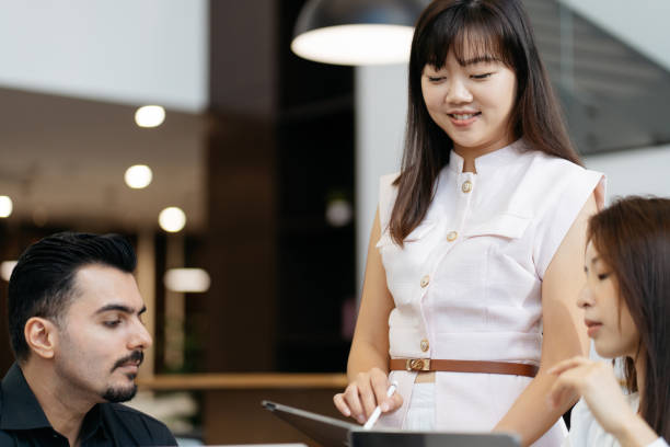 istock Asian business people working together in modern office 2204455758