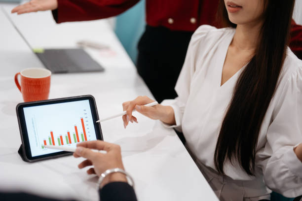 istock Asian business people working together in modern office 2204455775