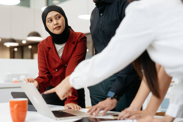 istock Asian business people working together in modern office 2204458175