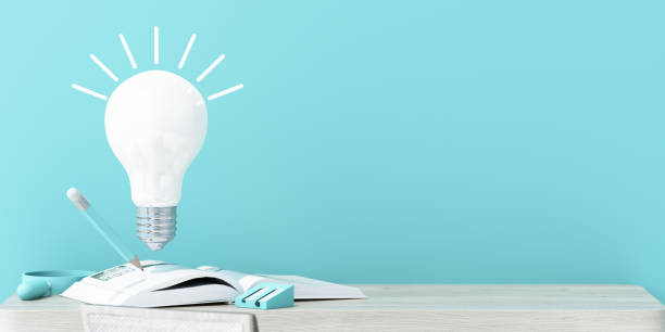 A floating light bulb symbolizes creativity above an open book with a pencil, on a minimal wooden desk with blue accents, evoking inspiration and learning. 3d rendering.