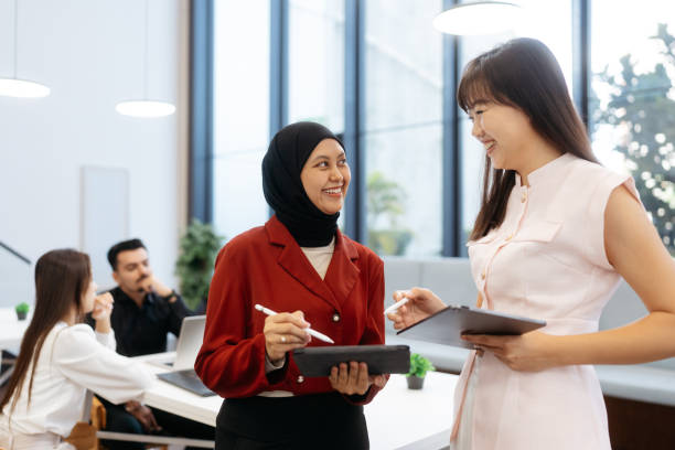 istock Asian businesswomen working and discussion in office 2204459204