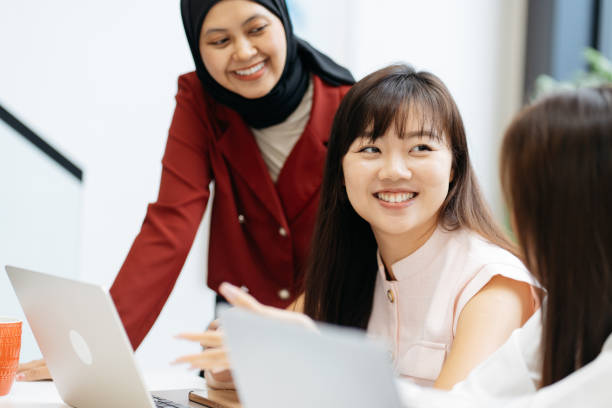 istock Asian business people working together in modern office 2204460108