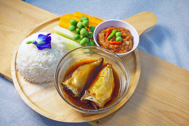 istock Traditional Thai Meal with Fish Sauce, Fresh Vegetables, and Rice 2204463198