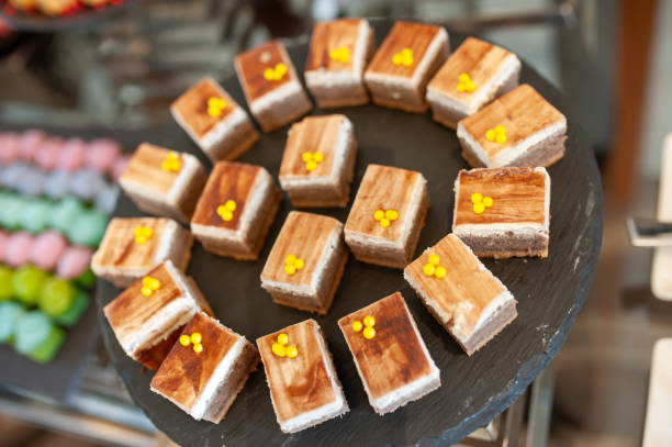 istock Delightful Assorted Desserts on a Round Black Slate Plate 2204463226