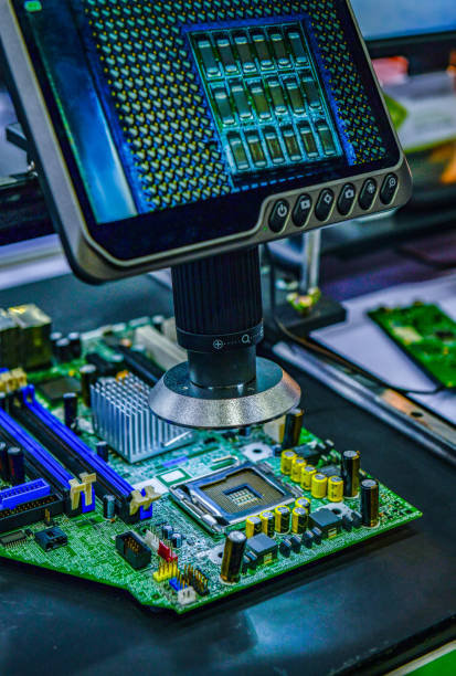 istock Digital microscope inspection system for checking the quality of electronic PCB circuit boards selective focus at factory 2204463901