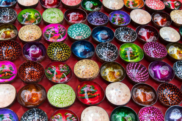Colorful patterned ceramic bowls on display. Kitchenware variety, artisanal craftsmanship, and decorative design in vibrant ceramic tableware