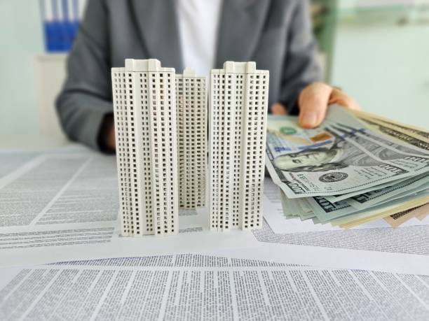 istock Real estate agent money and house concept 2204468313
