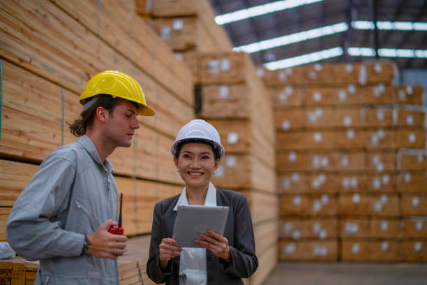 istock Blue collar workers  are working at wood factory. 2204470530