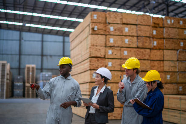 istock Blue collar workers  are working at wood factory. 2204470574