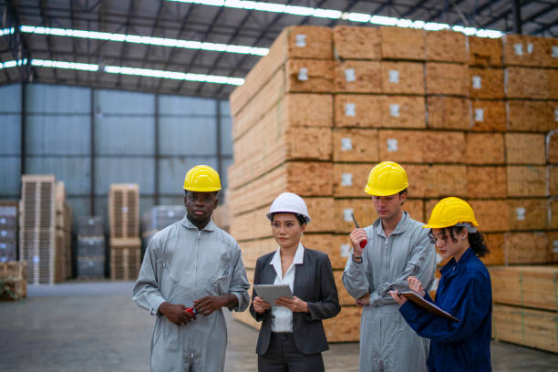 istock Blue collar workers  are working at wood factory. 2204470577