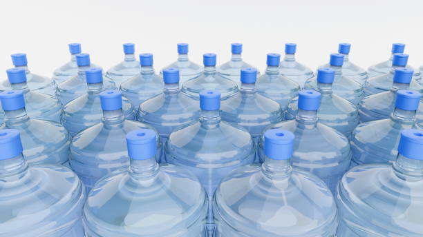 Numerous water bottles with blue caps are arranged closely together, creating a vibrant display in a well-lit setting. transparent surface highlights the clarity of the water. 3d render