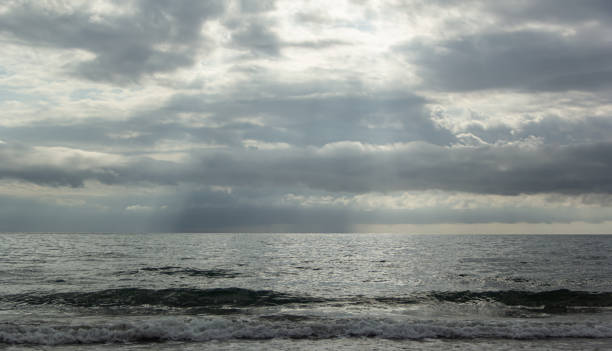 istock Heavy blue clouds over the sea 2204471112