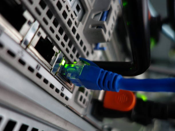 istock Close-Up View of Network Cable Connecting to Digital Device Port 2204471297