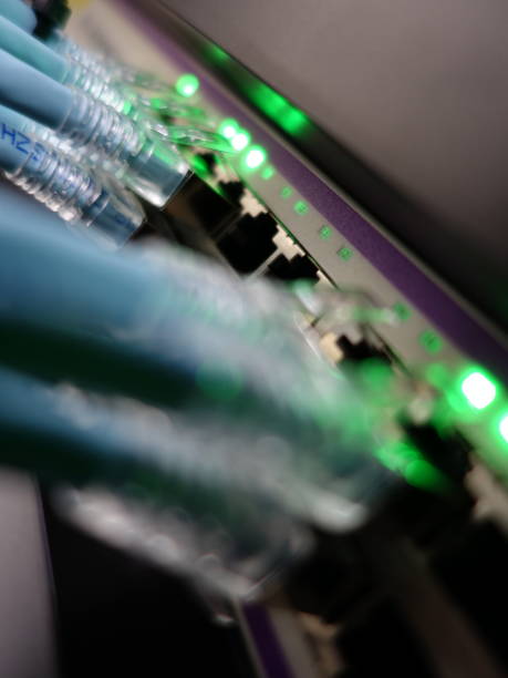istock Close-Up of Network Server with Bright LEDs and Ethernet Cables 2204471299