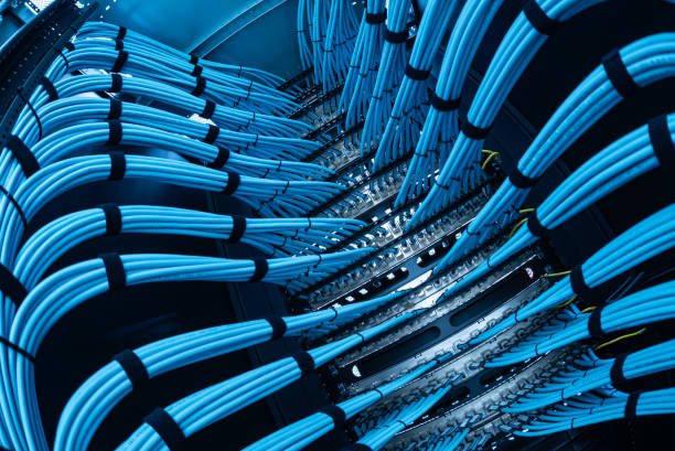 istock Intricate Network of Blue Data Cables in a Server Room Setup 2204471926