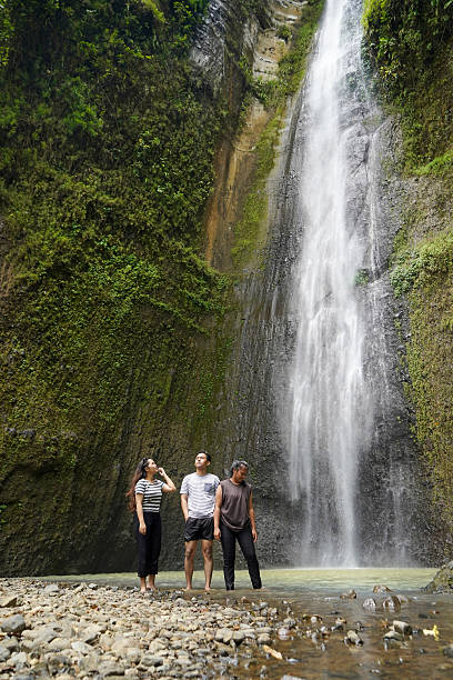 istock small group of happy young asian people exploring waterfall 2204475873