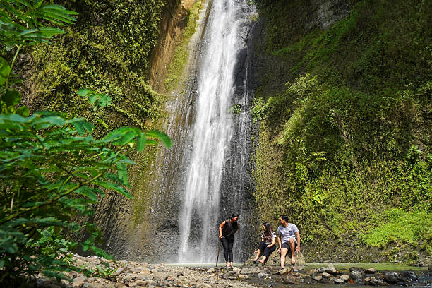 istock small group of happy young asian people exploring waterfall 2204476173